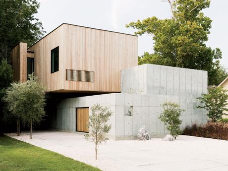 Modern Texas home facade with concrete walls and Siberian larch cladding