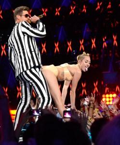 NEW YORK, NY - AUGUST 25: Robin Thicke and Miley Cyrus perform during the 2013 MTV Video Music Awards at the Barclays Center on August 25, 2013 in the Brooklyn borough of New York City. (Photo by Kevin Mazur/WireImage for MTV) ORG XMIT: 173533206 ORIG FILE ID: 177675213