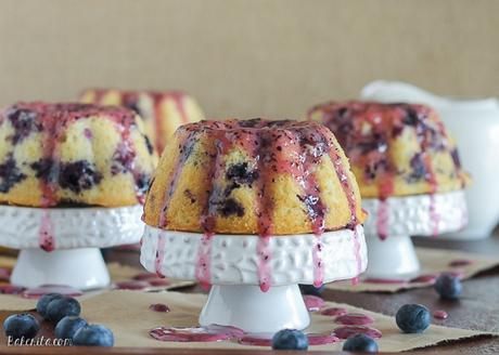 These Mini Lemon Blueberry Bundt Cakes are dripping with fruity blueberry glaze. These mini cakes are small enough so that no one has to share!