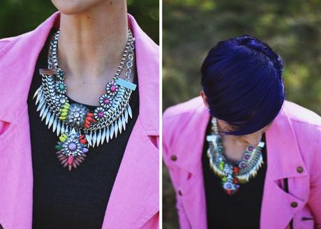 Outfit details: layered statement necklaces, pink moto jacket, purple pixie cut