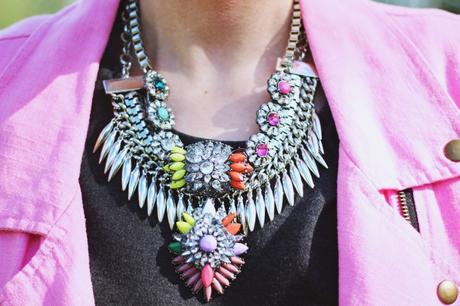 Outfit details: layered statement necklaces, pink moto jacket
