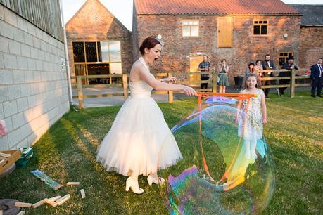 Barmbyfield Barn wedding photography lawn games and hula hoop giant bubbles