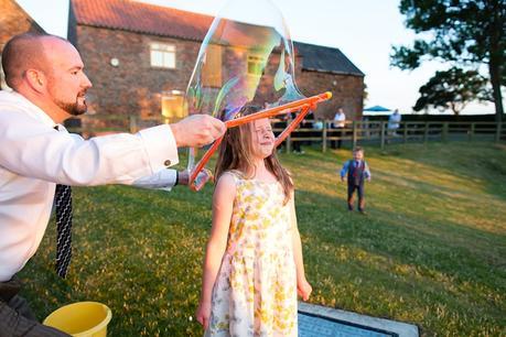 Barmbyfield Barn wedding photography lawn games and hula hoop giant bubbles