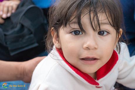 Young Mexican girl wanted her photo made while riding a river boat tour.