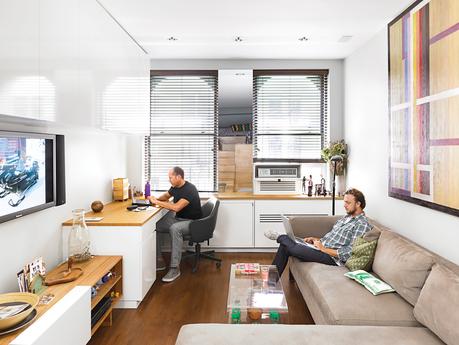Living office room with oak paneling and wall-size custom cabinetry