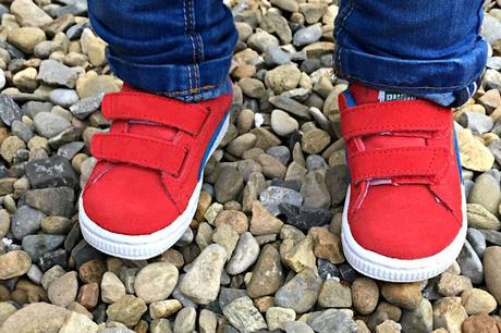 Get the Label red Puma kids trainers being worn by a child