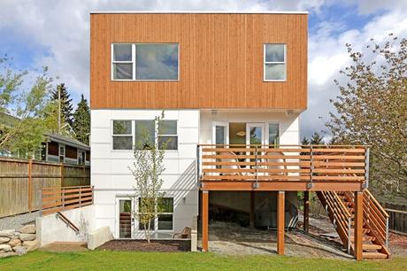 Eco-friendly prefab by Greenfab with cedar and James Hardie panel facade.