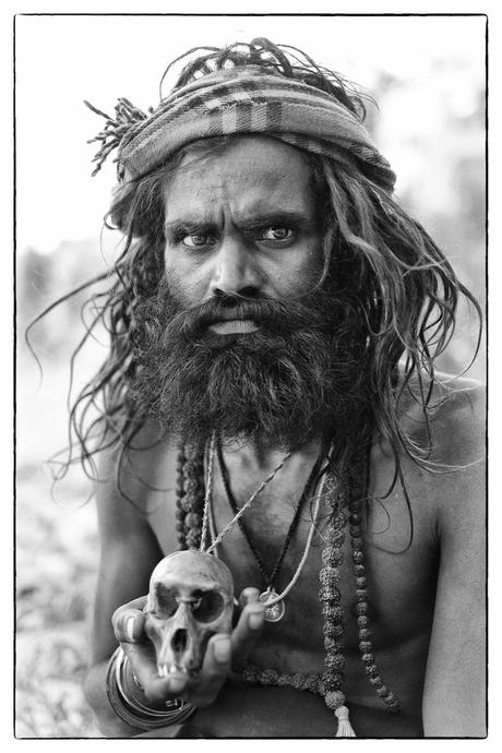An Aghori sits by the Ganges in Varanasi.: 