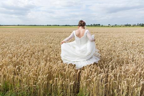 Barmbyfield Barn Wedding Photographer Bride and groom portraits in barley field
