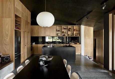 Oxidized steel kitchen island and blackbutt cabinets in home designed by Kirsten Thompson Architects.