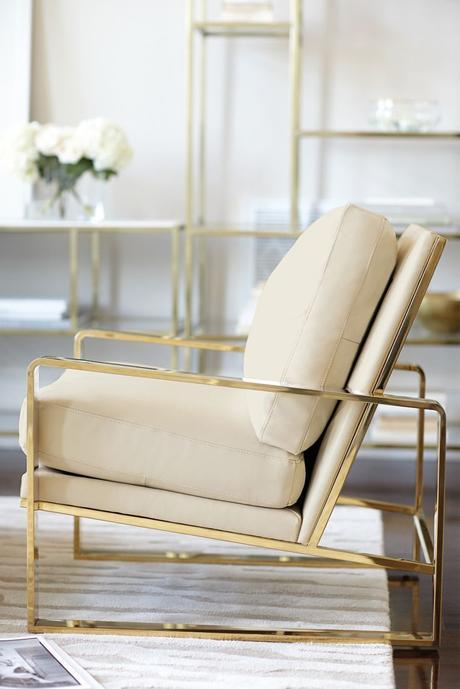 Bernhardt Interiors | Dorwin Chair, polished brass finish, shown in ivory leather | Jet Set Entertainment Piers and Console: 
