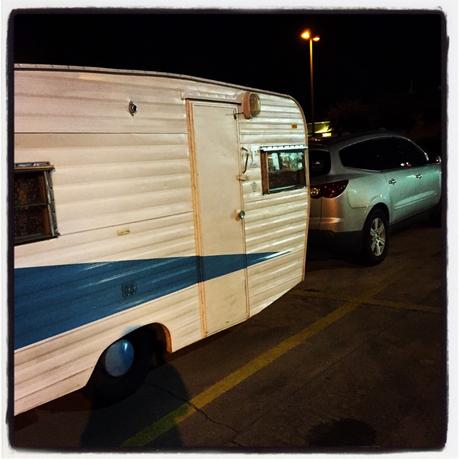 vintage trailer parked at truck stop