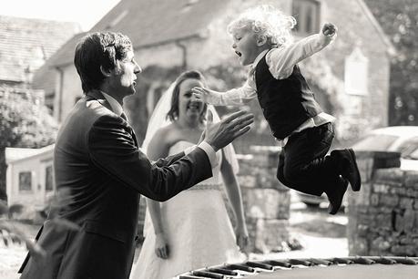 couple playing with son at Kingston Country Courtyard Wedding