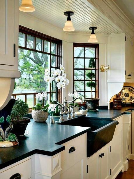 unique black farmhouse sink with white cabinets
