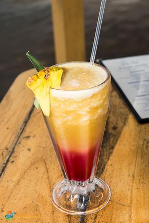 A tropical drink in Bocas del Toro, Panama: pineapple and orange juices blended with grenadine syrup.
