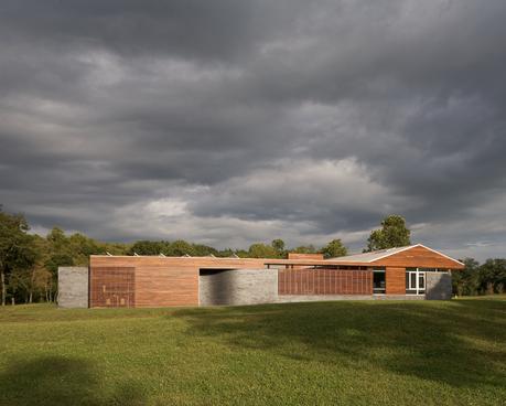Curved House brick and ironwood facade
