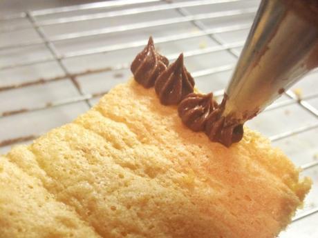 piping rosettes on patiesserie genoise sponge for mary berry chocolatines