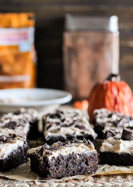 These Pumpkin Spice Latte Brownies are homemade pumpkin brownies infused with coffee and topped with a whipped pumpkin spice latte frosting.