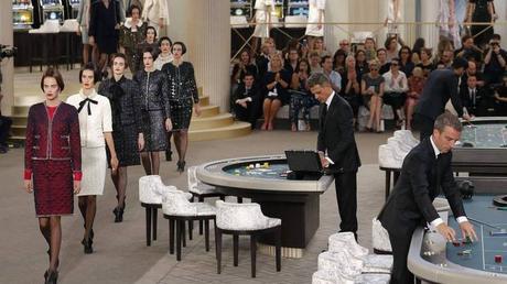 Models present creations by German designer Karl Lagerfeld as part of his Haute Couture Fall Winter 2015/2016 fashion show for French fashion house Chanel at the Grand Palais in Paris