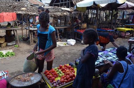 children selling vegetables