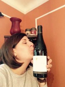 kissing wine bottle