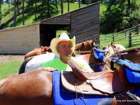 Ray Rugg of Rugg's Outfitting saddling up our horses