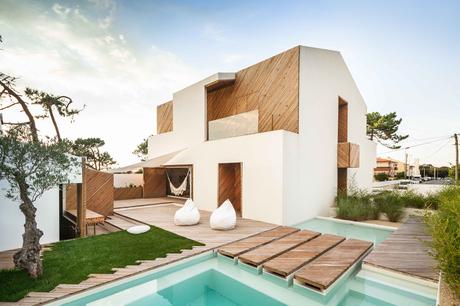 Portuguese beach house with stucco and silver wood