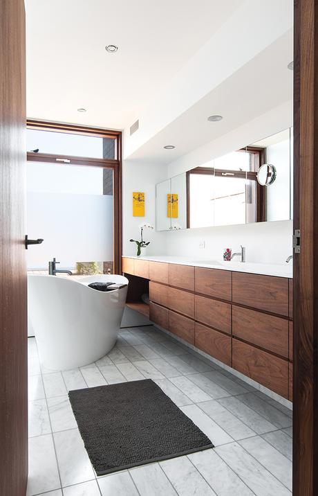 Modern bathroom with bathtub and cedar window