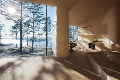 Norwegian kitchen with floor-to-ceiling windows and custom-built cabinets. 