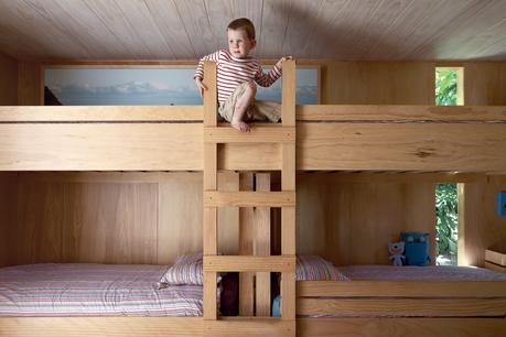 In the kids’ room, Seamus climbs the bunk beds he shares with his siblings.