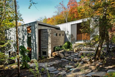 Eramosa limestone facade of Quebec vacation home by boom town.
