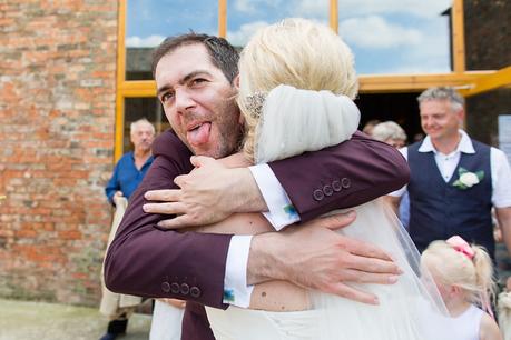 Canidid photographs at barmbyfiled barn wedding 