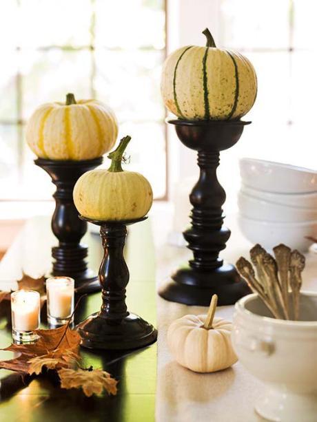 white pumpkins on candlesticks