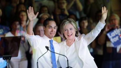 Democratic presidential candidate Hillary Rodham Clinton, right, stands with Housing and Urban Development Secretary Julian Castro, left, after she was introduced during a campaign event, Thursday, Oct. 15, 2015, in San Antonio. (AP Photo/Eric Gay)
