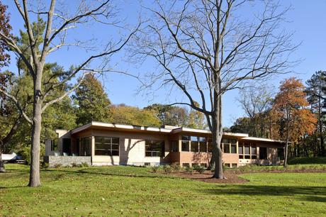 Facade with bronze-clad windows of Massachusetts renovation by Hammer Architects.