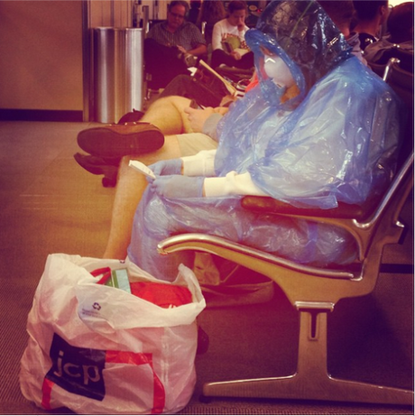 woman in hazmat suit in Dulles