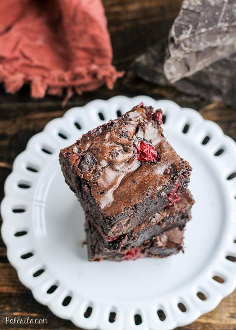 These Cranberry Brownies are made with dark chocolate, fresh and dried cranberries, and dark chocolate covered cranberries! These are the perfect addition to a holiday dessert platter.