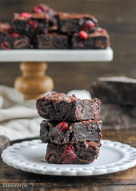 These Cranberry Brownies are made with dark chocolate, fresh and dried cranberries, and dark chocolate covered cranberries! These are the perfect addition to a holiday dessert platter.