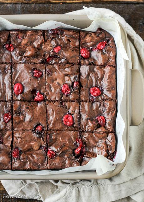 These Cranberry Brownies are made with dark chocolate, fresh and dried cranberries, and dark chocolate covered cranberries! These are the perfect addition to a holiday dessert platter.