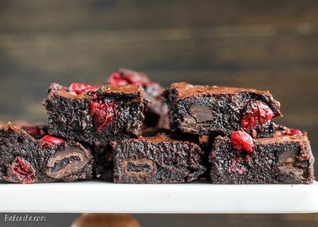 These Cranberry Brownies are made with dark chocolate, fresh and dried cranberries, and dark chocolate covered cranberries! These are the perfect addition to a holiday dessert platter.