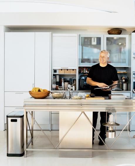 Opening onto the open-plan living and dining rooms, the aluminum Bulthaup System 20 kitchen with its nine-foot-long stainless steel island and Miele appliances has become a focal point of the house. Pressed in one seamless sheet of steel, the island, Pica