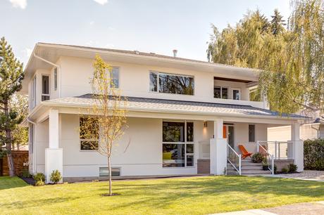Stucco and cedar facade of Calgary renovation by DOODL
