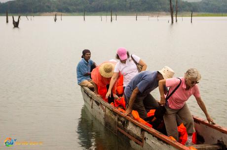 Carefully unloading from a narrow wooden boat