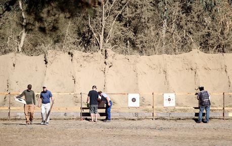 Shooters inspect and retrieve their targets at the Chabot Gun Club in Castro Valley, Calif., on Friday, Oct. 30, 2015. T(Anda Chu/Bay Area News Group)