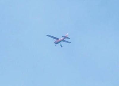 Video of Skydiver getting stuck underneath airplane at 10,000 feet