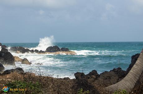 Waves crash on the east end of Isla Grande Panama, sending spray into the wind.