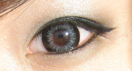 Grey colored lenses on brown eyes