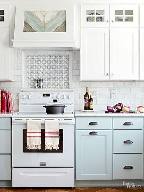 Tile can add a raised facet to a space to help boost visual interest. in this pastel kitchen, the backsplash tile -- a miniature mosaic bordered by a raised tile -- picks up on the cabinet details and offers a focal point behind the range.: 