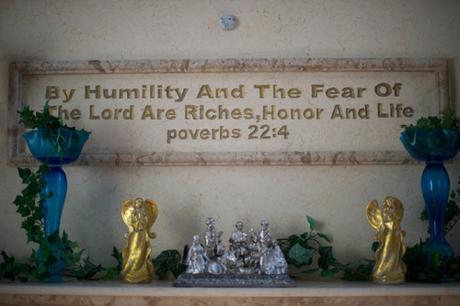 Quote from Proverbs chiseled on wall, with 