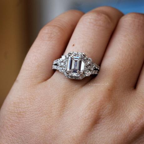 Emerald cut diamond halo engagement ring